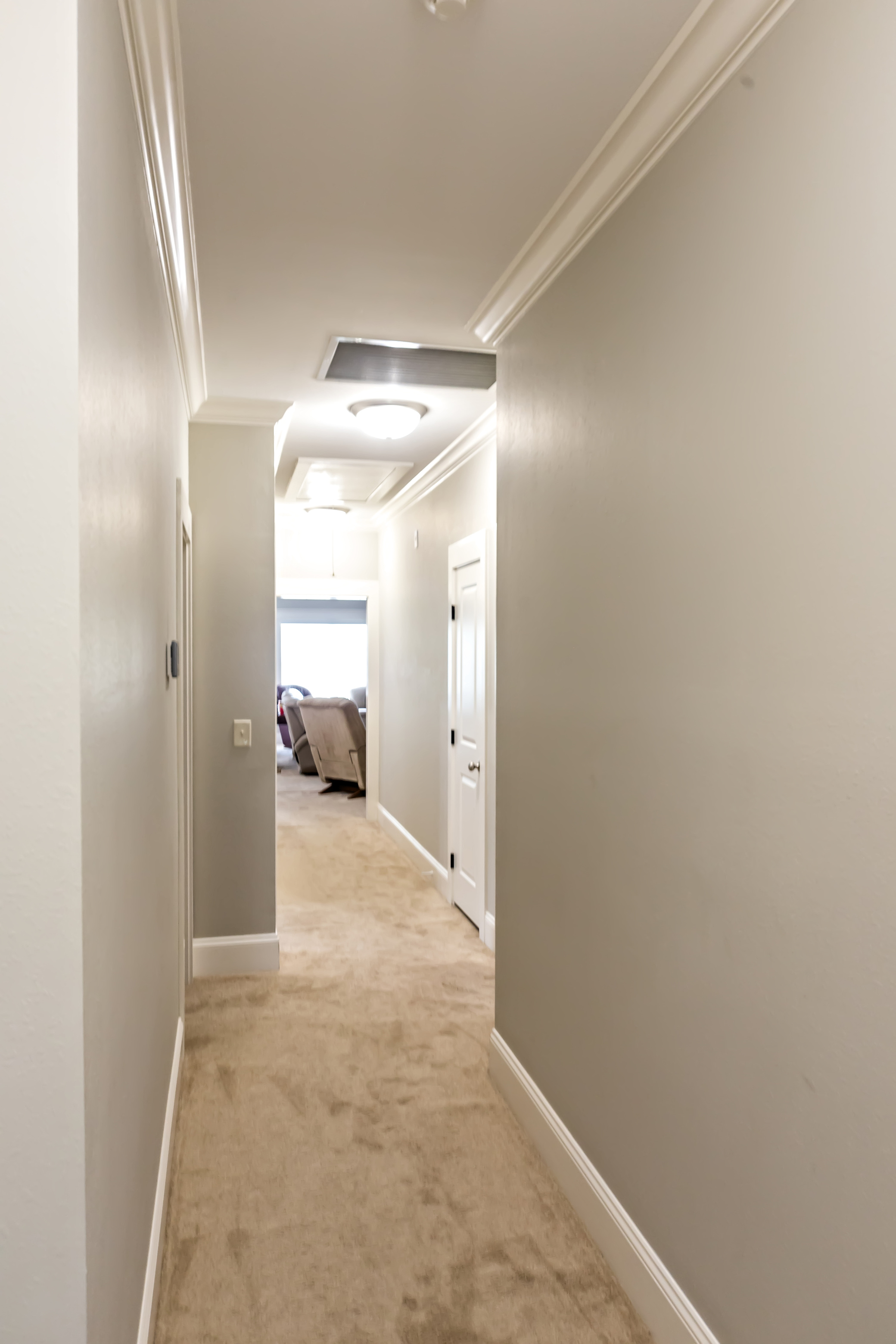 A gray beige greige hallway in a new construction house